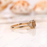 Side profile of champagne cushion moissanite ring in yellow gold