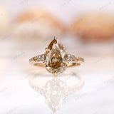 Front view of antique champagne moissanite pear ring in yellow gold