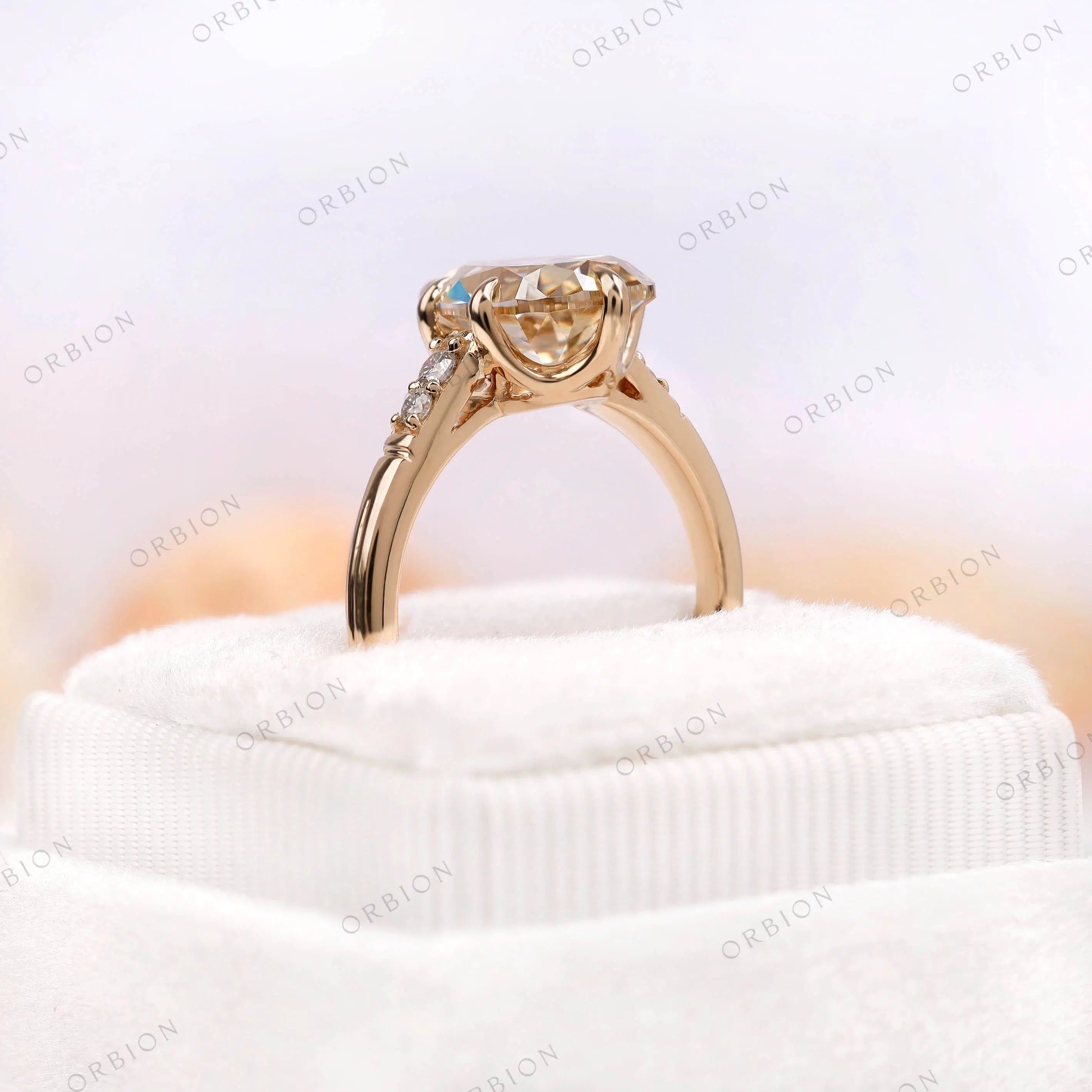 Ring box display of antique champagne moissanite pear ring"