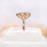 Detailed close-up of antique champagne moissanite ring from side angle