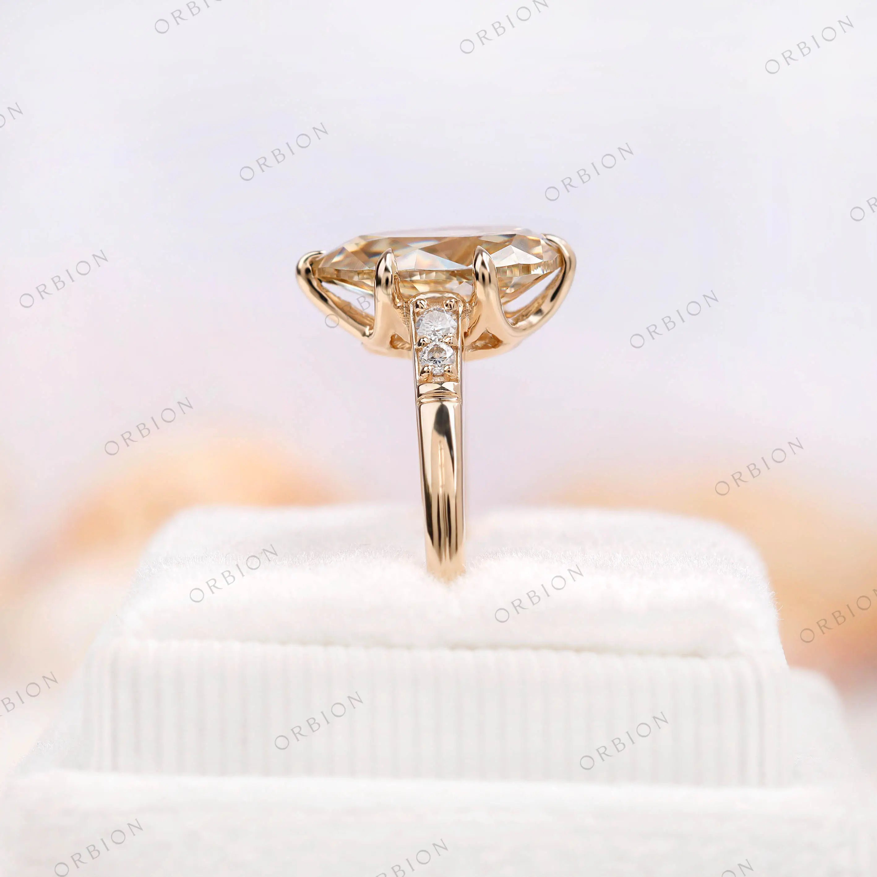 Detailed close-up of antique champagne moissanite ring from side angle
