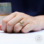 Top view of pear old mine cut champagne moissanite ring