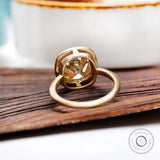Back view of bezel set elongated cushion moissanite ring in yellow gold
