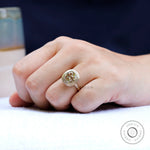 Contemporary matte finish bezel moissanite solitaire ring on finger
