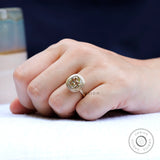 Contemporary matte finish bezel moissanite solitaire ring on finger