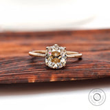 Elongated cushion old mine cut light champagne moissanite solitaire ring in yellow gold front view