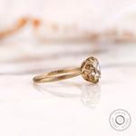 Side view showing OMC cushion champagne solitaire ring in yellow gold