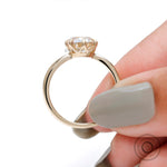 Slim yellow gold band with elongated cushion moissanite side angle