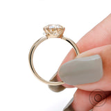 Slim yellow gold band with elongated cushion moissanite side angle
