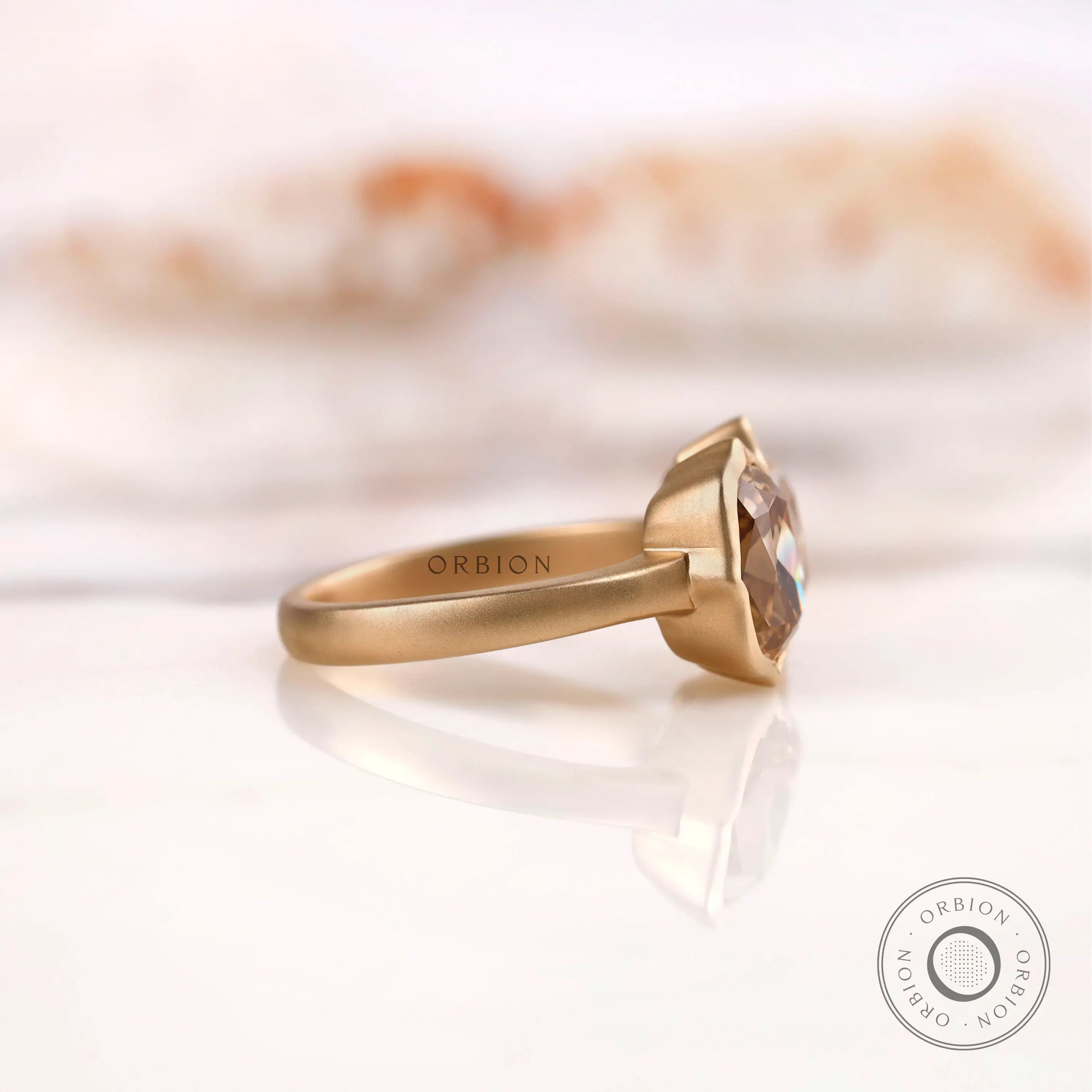 Two-stone elongated cushion moissanite ring in 10K yellow gold side view