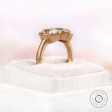 Sculpted bezel moissanite ring in yellow gold