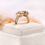 Elevated display view of bezel set Toi et Moi ring in yellow gold