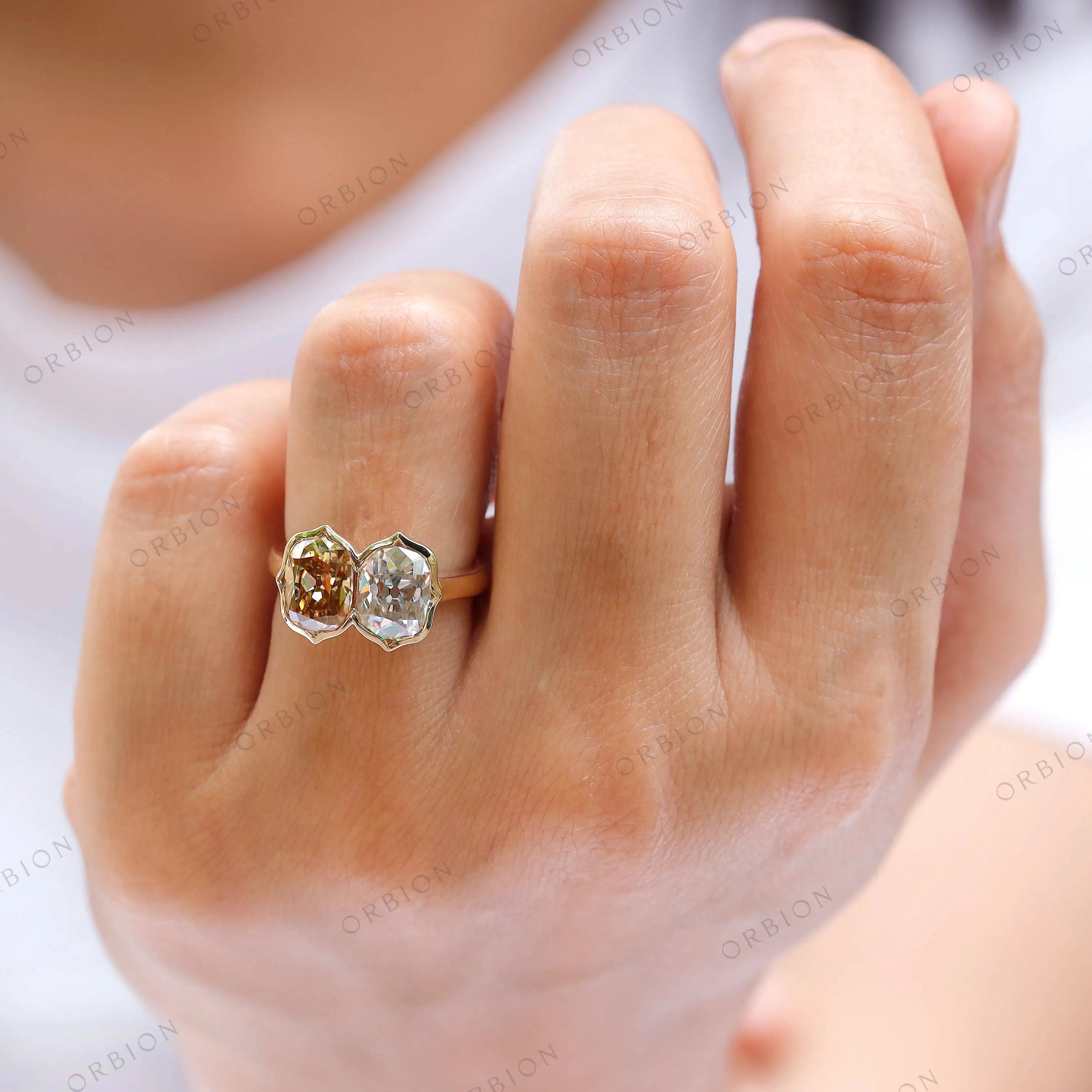 On-hand view of dual elongated cushion moissanite bezel ring