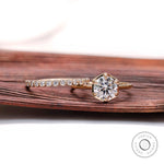 Cathedral style engagement ring showcasing elevated center stone