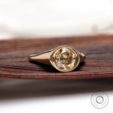 Old European cut moissanite solitaire signet ring front angle close-up