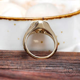 Minimalist solitaire bezel signet ring with light champagne moissanite