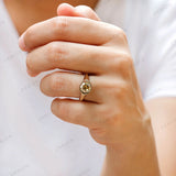 Hand worn bezel set solitaire moissanite ring front view