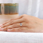 Elegant three stone ring worn on hand