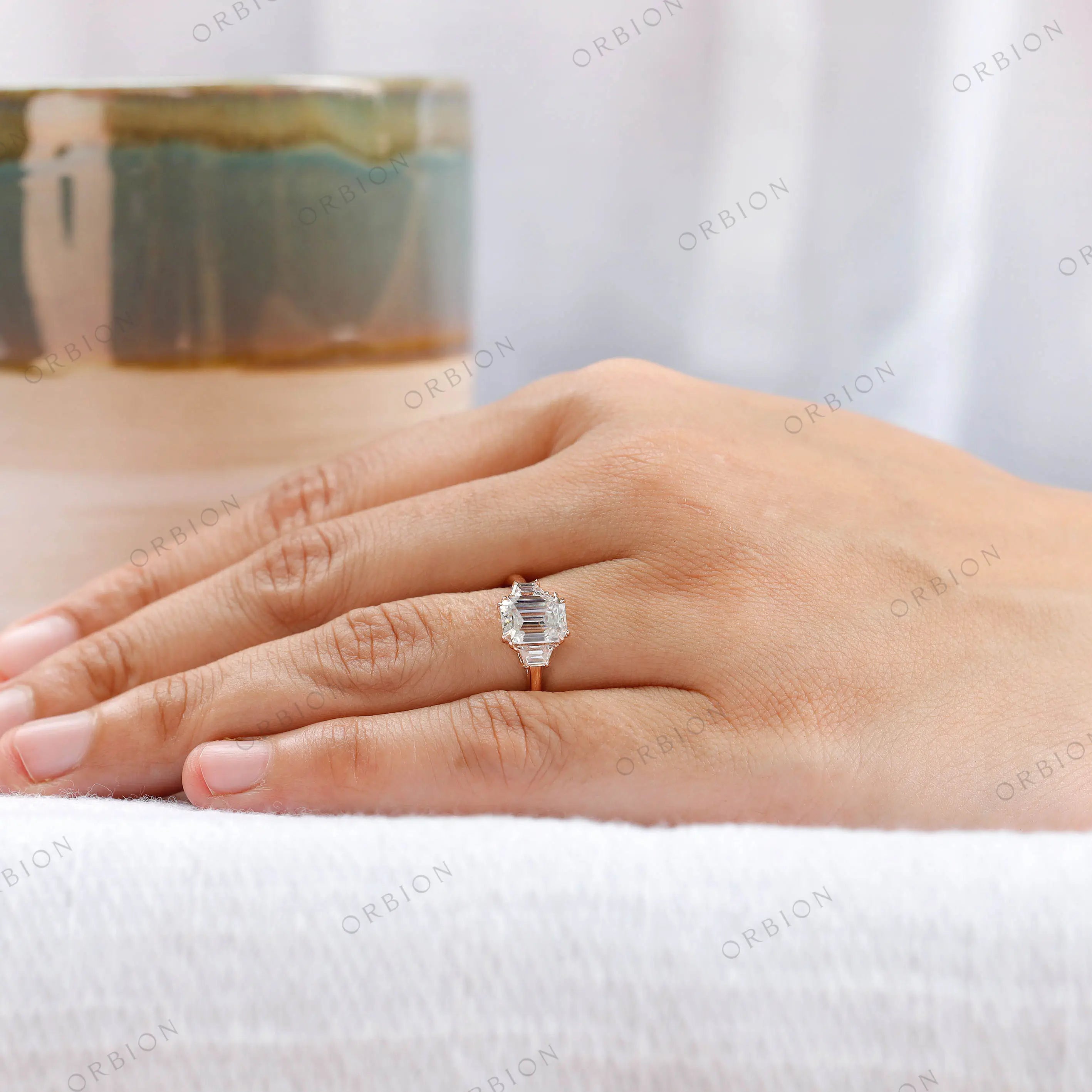 Elegant three stone ring worn on hand