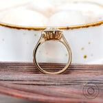 Pear bezel solitaire ring lifestyle image with natural lighting
