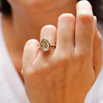 Pear moissanite solitaire ring worn on hand top view