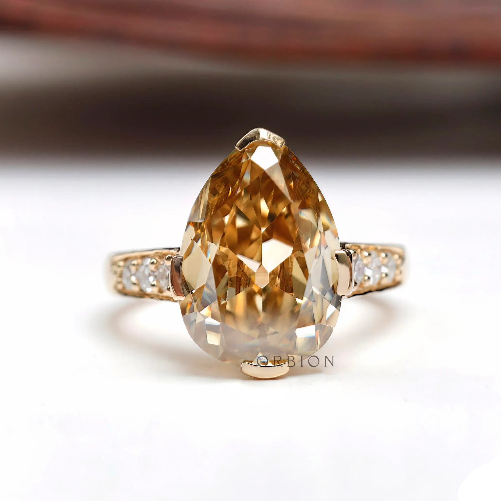 Light champagne pear moissanite Old Mine cut ring top view