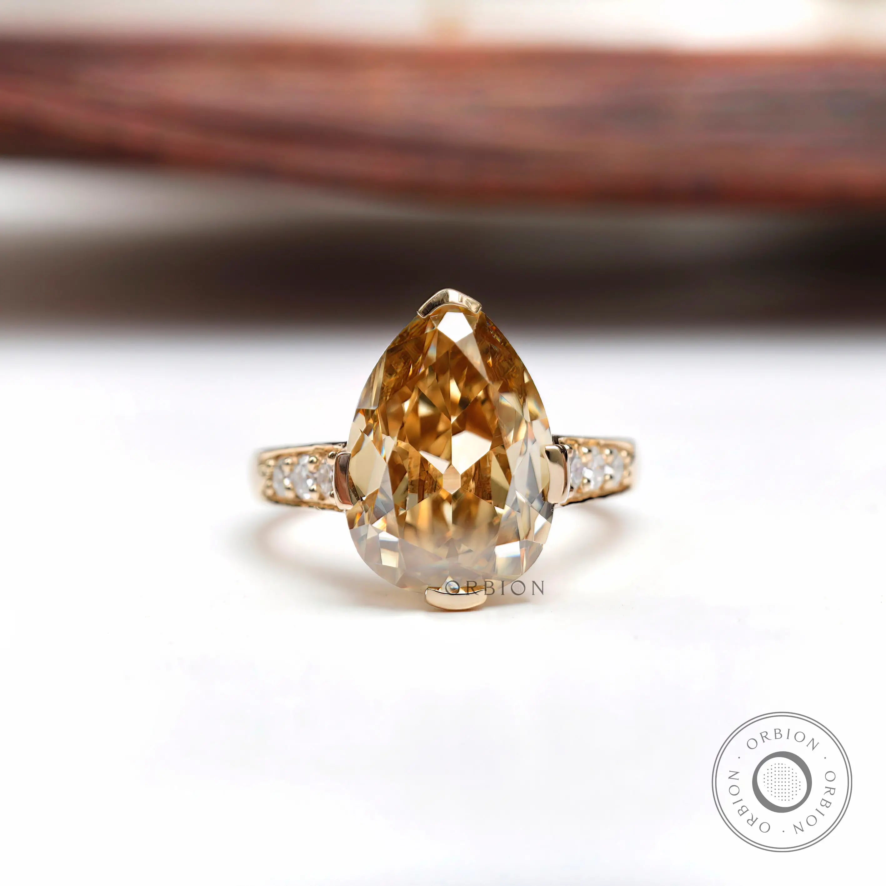 Light champagne pear moissanite Old Mine cut ring top view