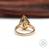 Underside gallery detail of pear moissanite ring in yellow gold