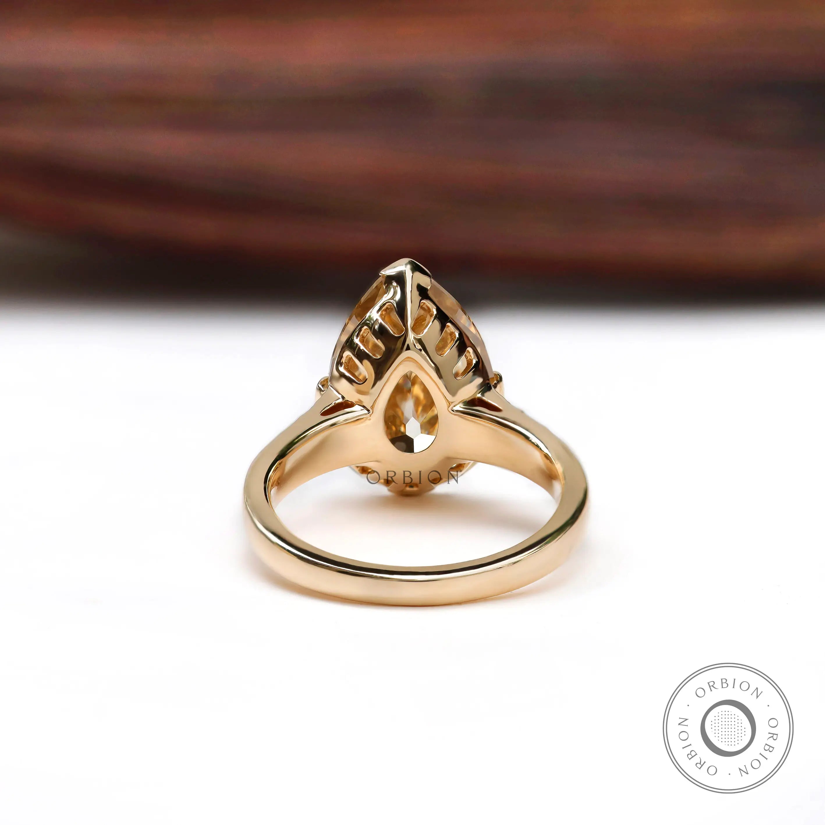 Underside gallery detail of pear moissanite ring in yellow gold