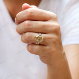 Hand worn champagne pear moissanite ring front view