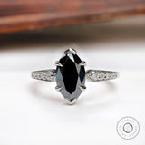 Deep green marquise Old Mine Cut moissanite ring in 10K white gold front view