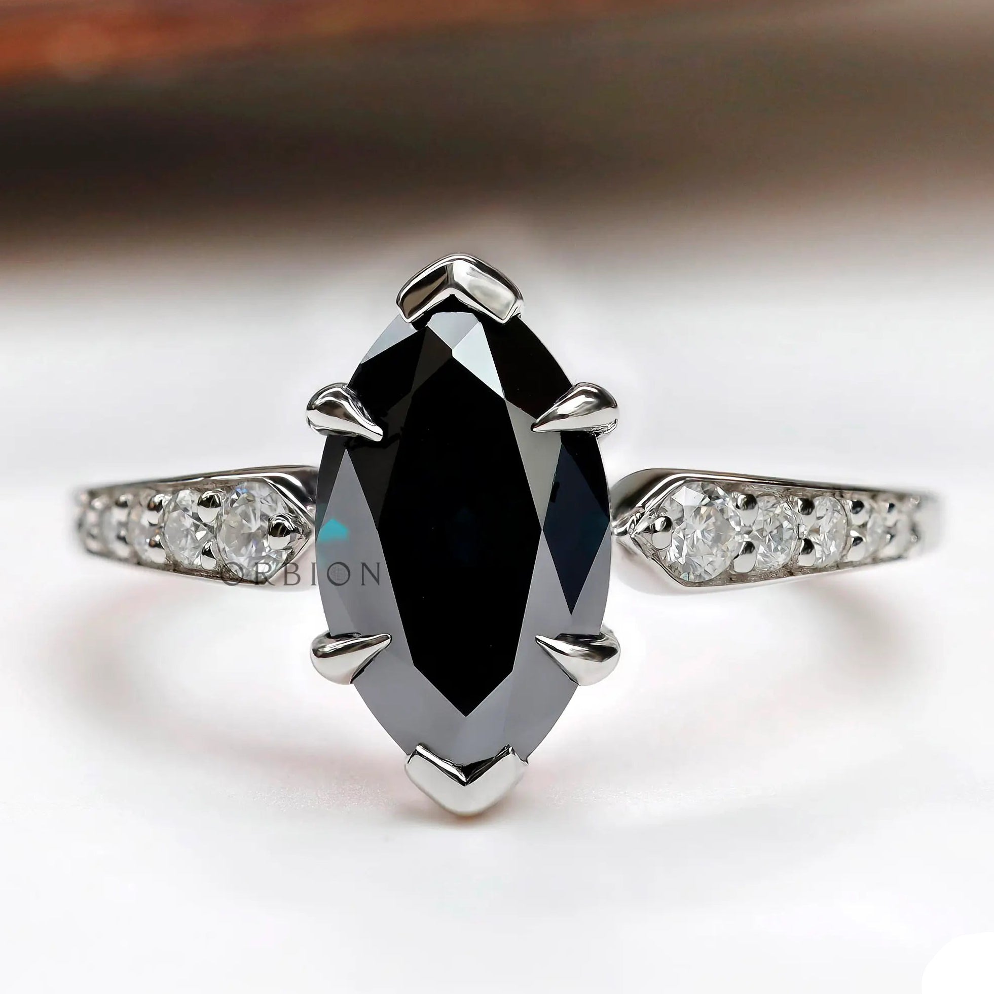 Deep green marquise Old Mine Cut moissanite ring in 10K white gold front view