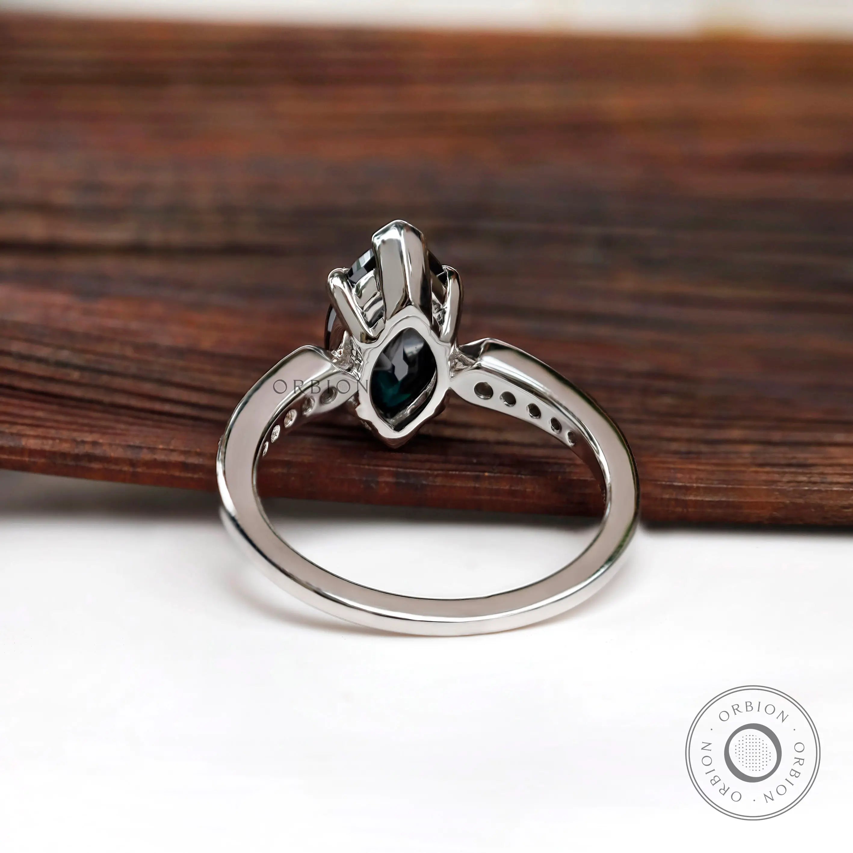 Underside view of marquise moissanite engagement ring in high polish white gold