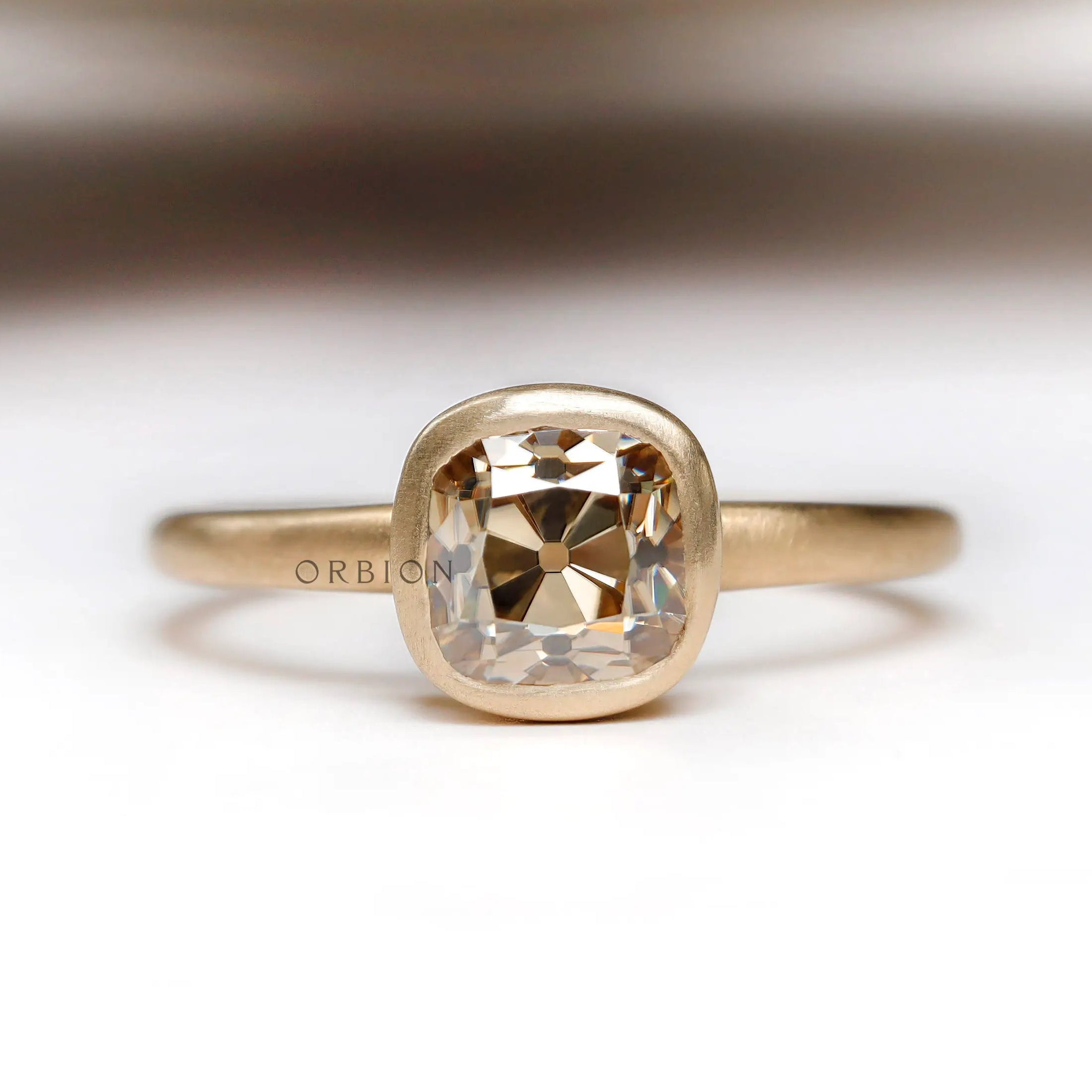 Elegant solitaire cushion cut dark champagne moissanite bezel set engagement ring