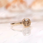Close-up of Moissanite Light Champagne Old Mine Cut bezel set solitaire ring in 10K yellow gold