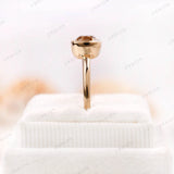 Moissanite Light Champagne Old Mine Cut bezel set solitaire ring in 10K yellow gold