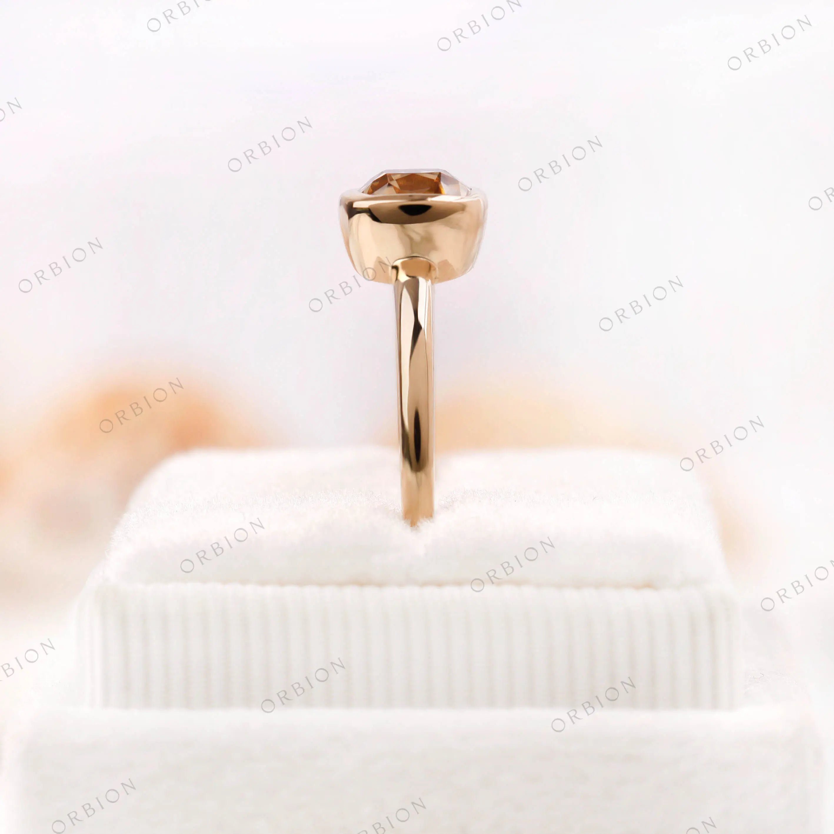 Moissanite Light Champagne Old Mine Cut bezel set solitaire ring in 10K yellow gold