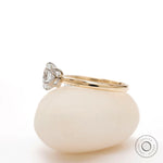 Two tone gold solitaire engagement ring side view