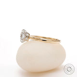 Two tone gold solitaire engagement ring side view