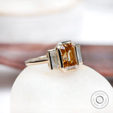 2.8 carat old mine cut emerald moissanite ring with baguette side stones