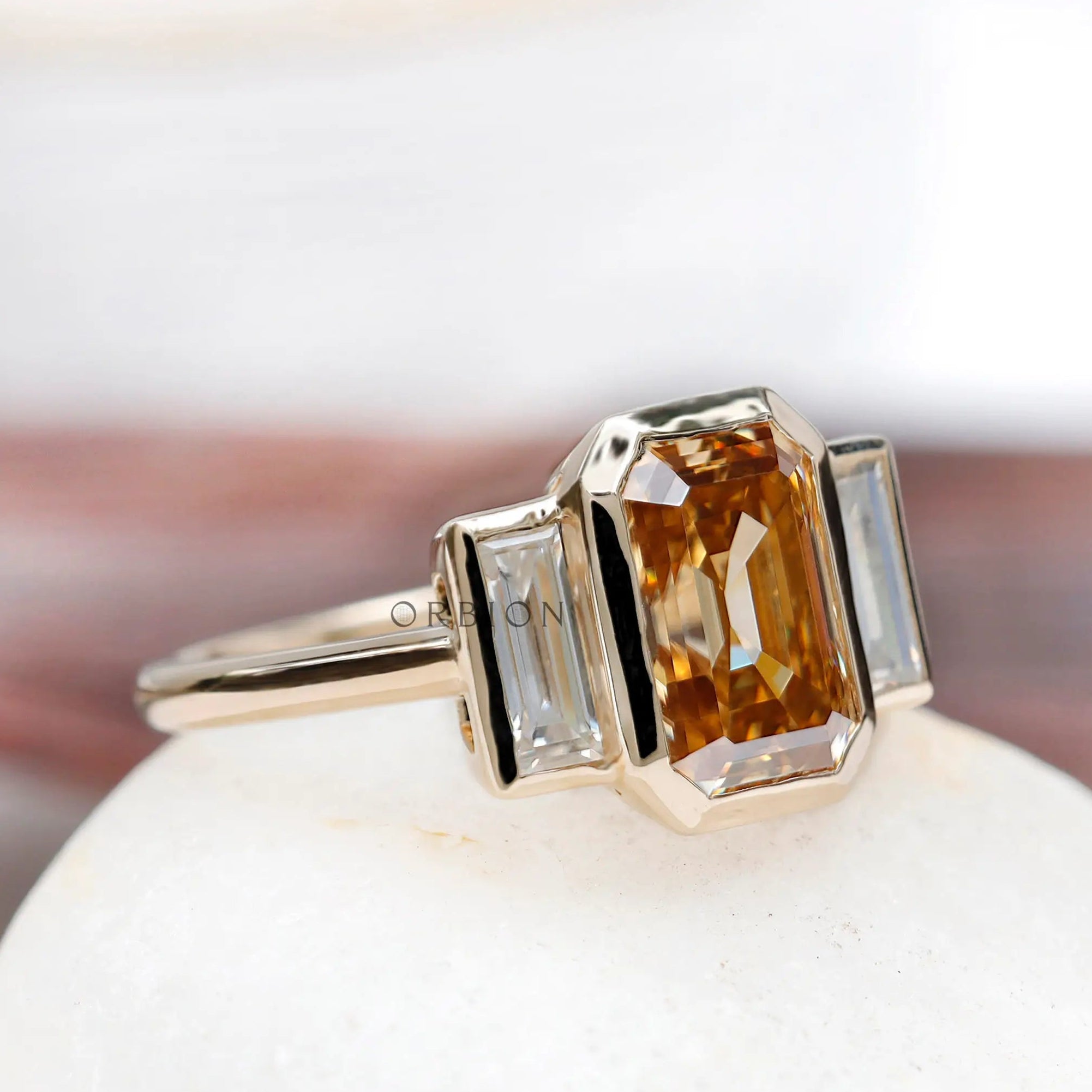 2.8 carat old mine cut emerald moissanite ring with baguette side stones