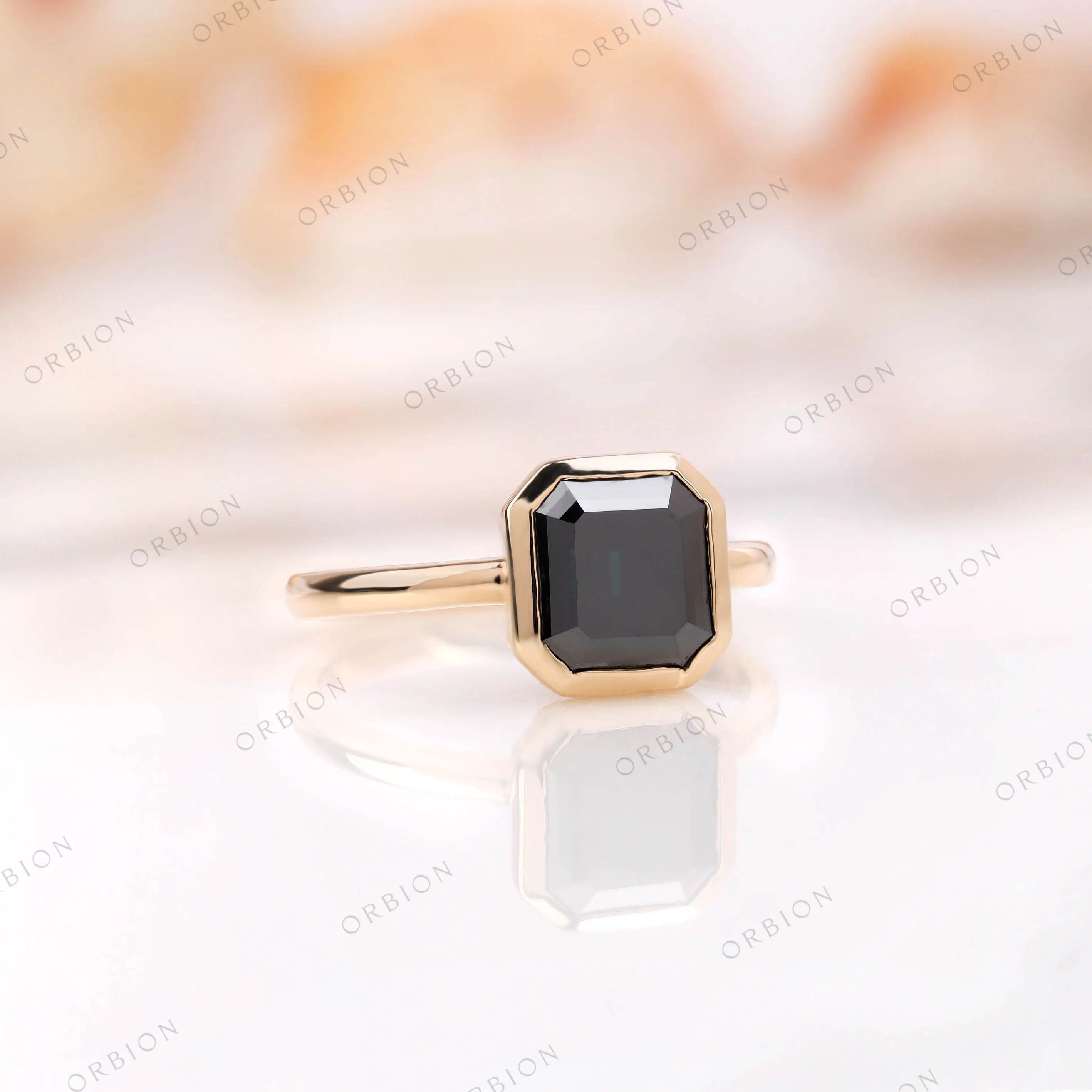 Dark green moissanite geometric ring in yellow gold bezel setting