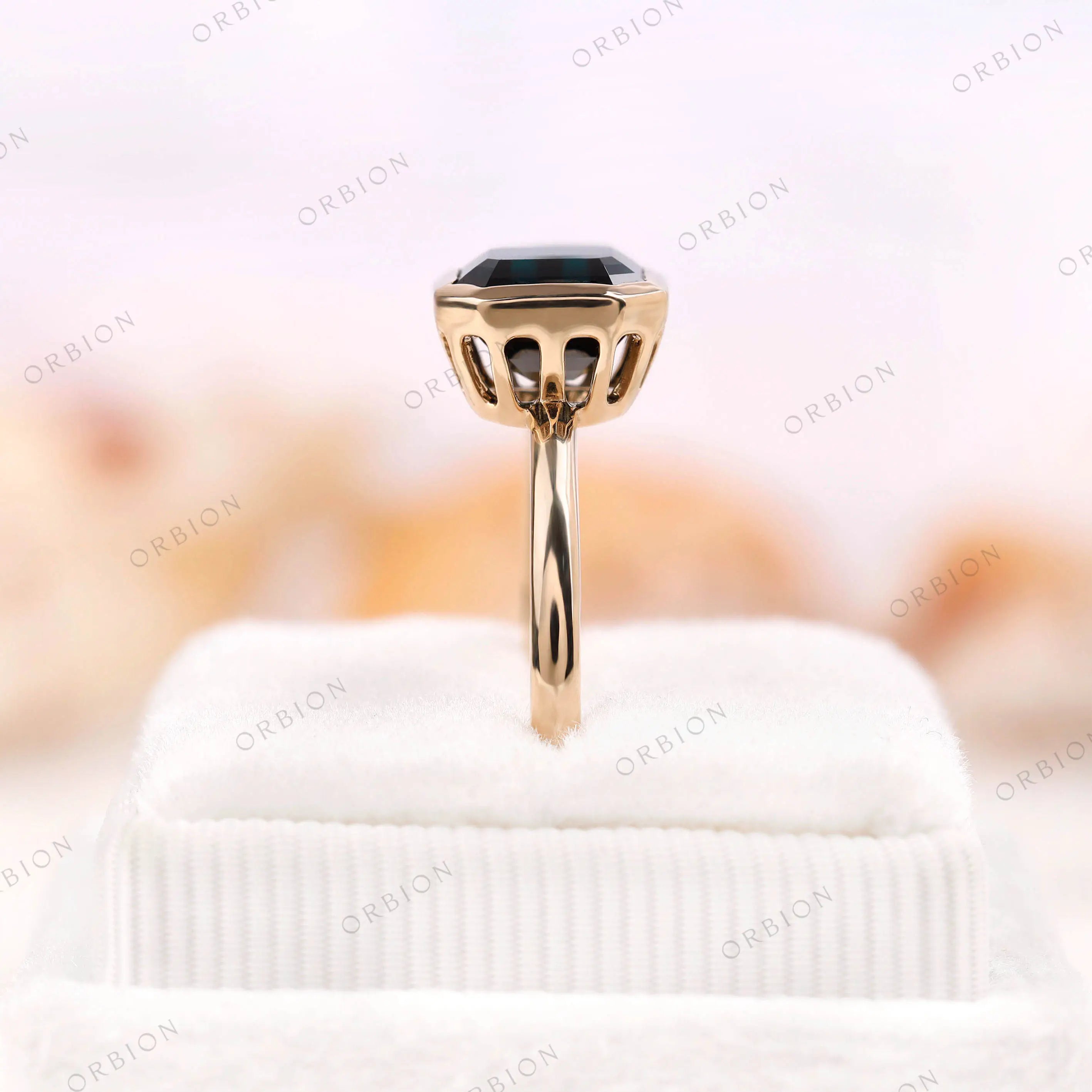 Side profile of Asscher cut moissanite ring in 10K yellow gold