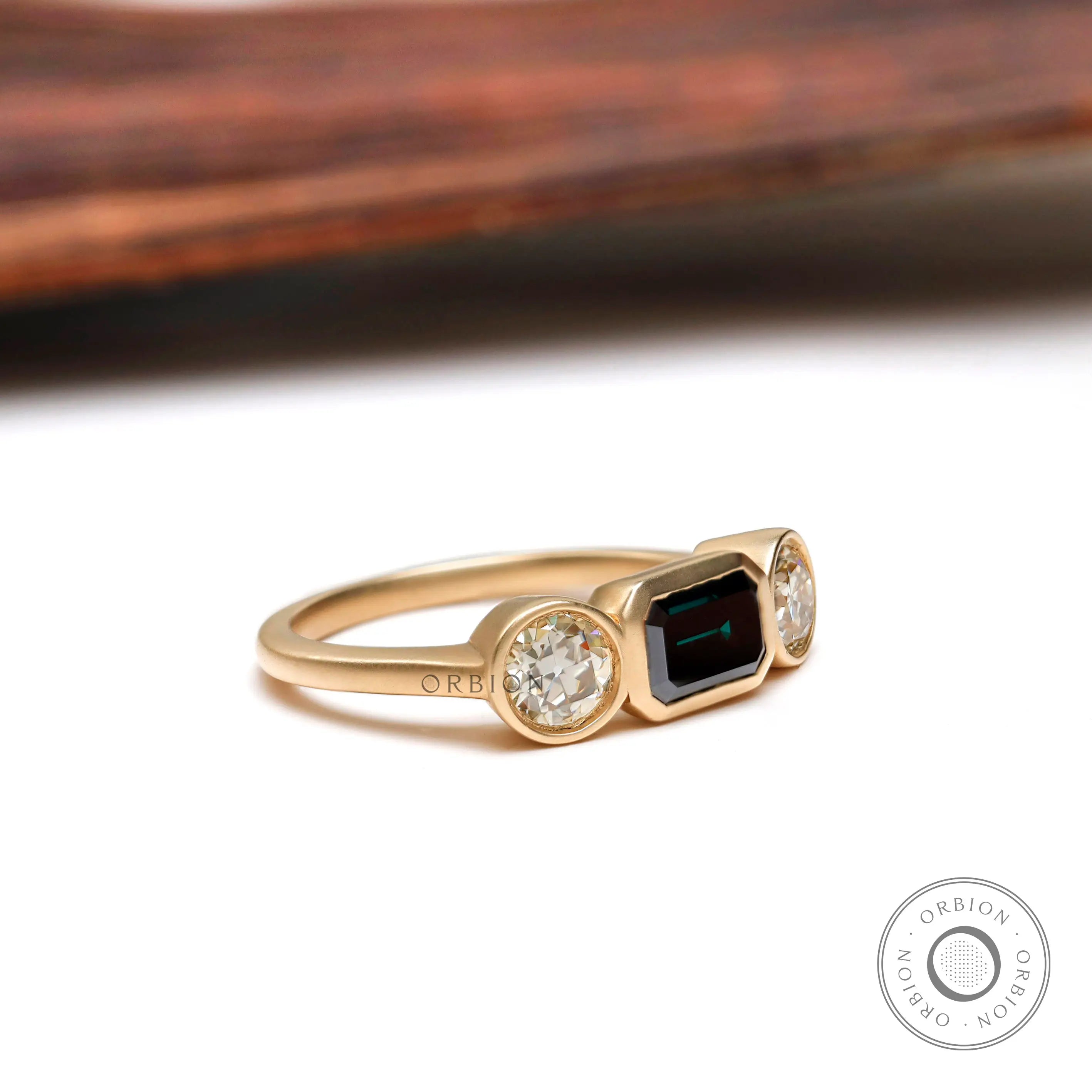 Vintage three stone green moissanite ring with champagne side stones