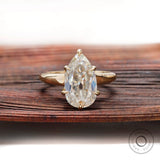 Pear moissanite solitaire ring old mine cut in yellow gold front view