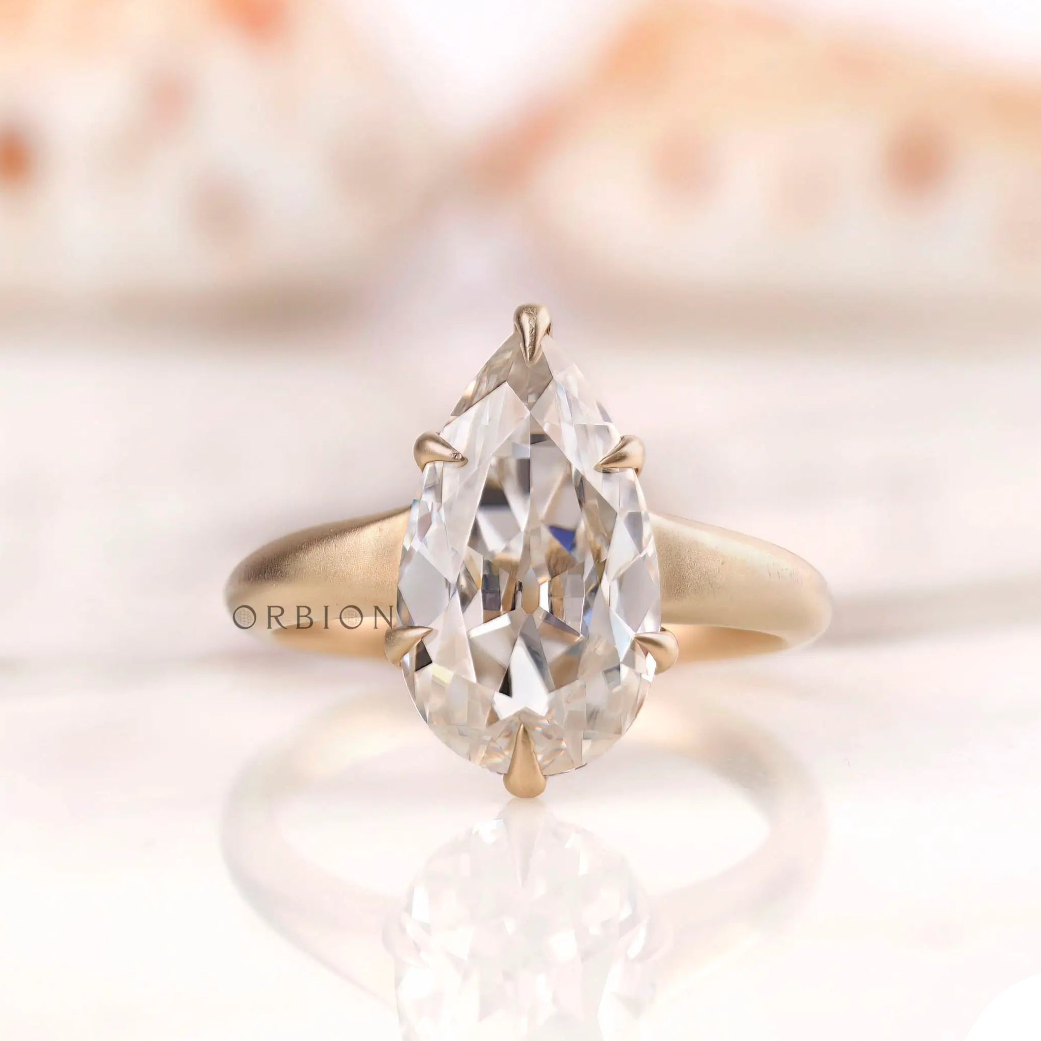 Front View of Old Mine Cut Pear Moissanite Ring in Yellow Gold
