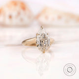 Close-up of the pear-shaped Moissanite in Yellow Gold Setting