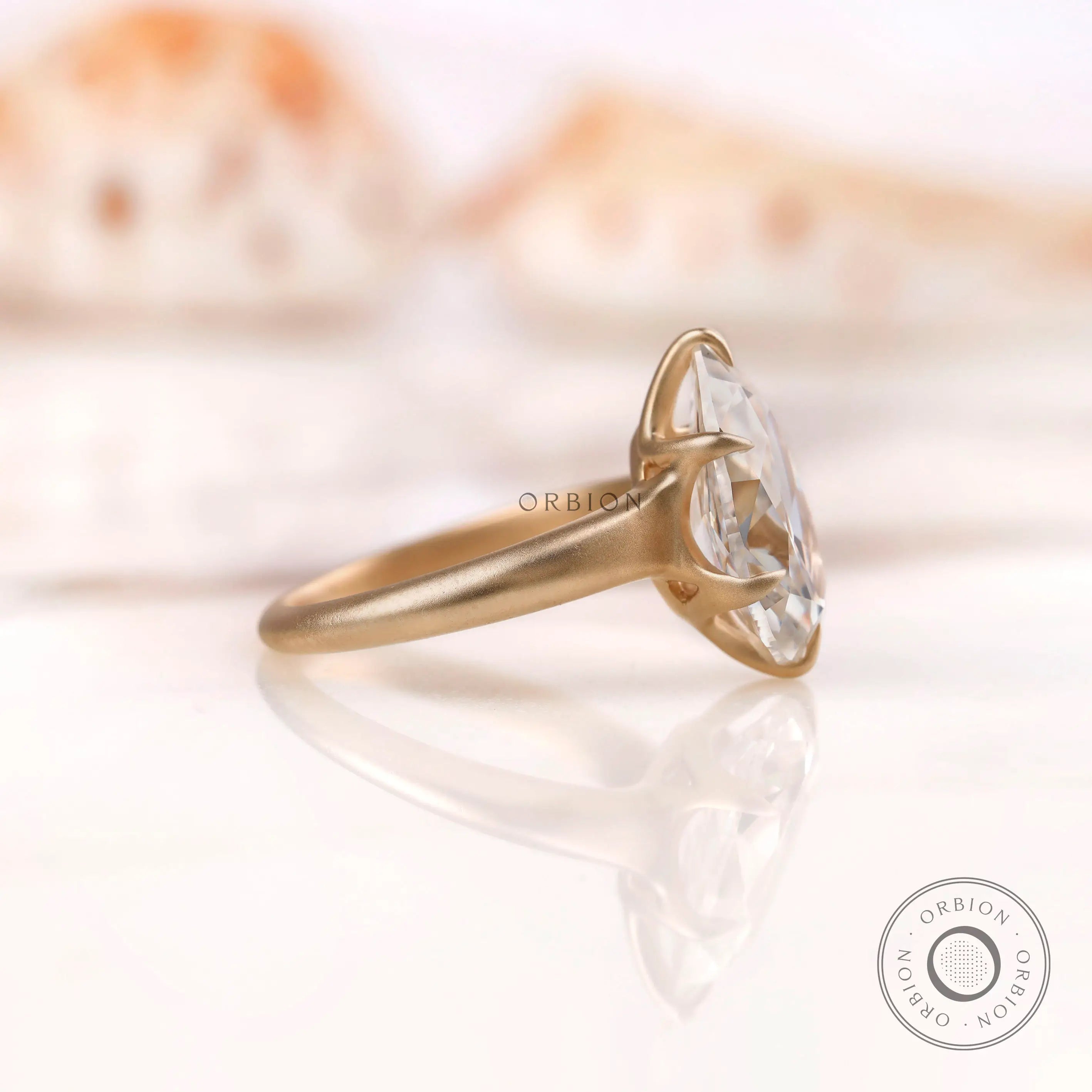 Side view of the Old Mine Cut Pear Moissanite Engagement Ring