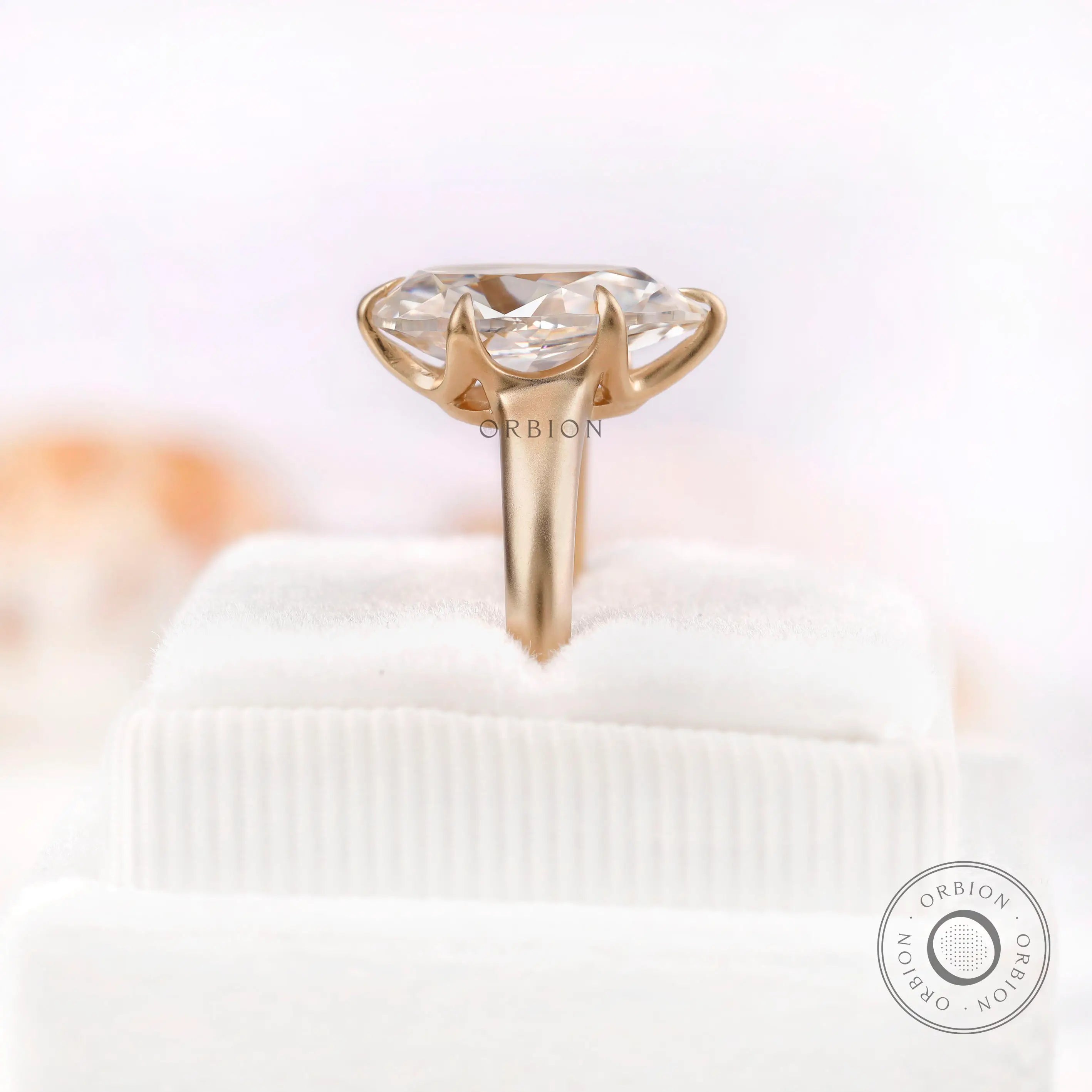 Moissanite engagement ring displayed on a ring box
