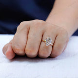 Classic solitaire pear moissanite ring worn on hand minimal gold band